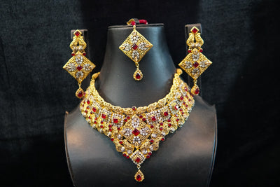 Gold plated set with glass red stones and real zircon stones