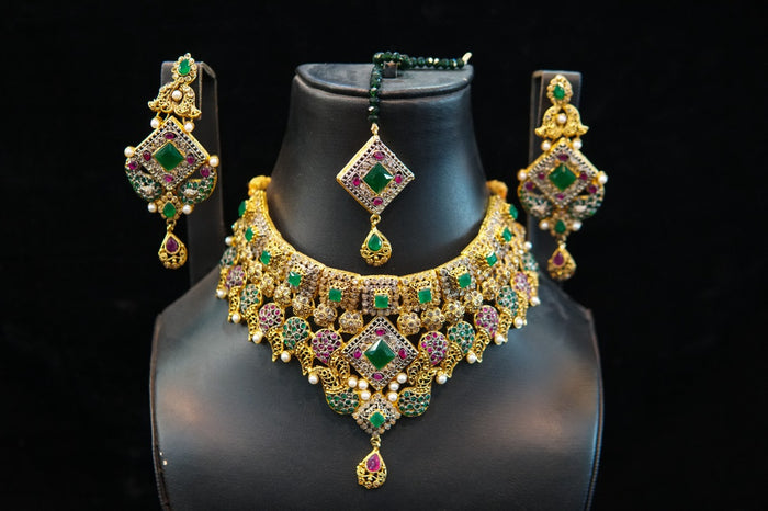 Casting set gold plated with real stones emeralds and Ruby